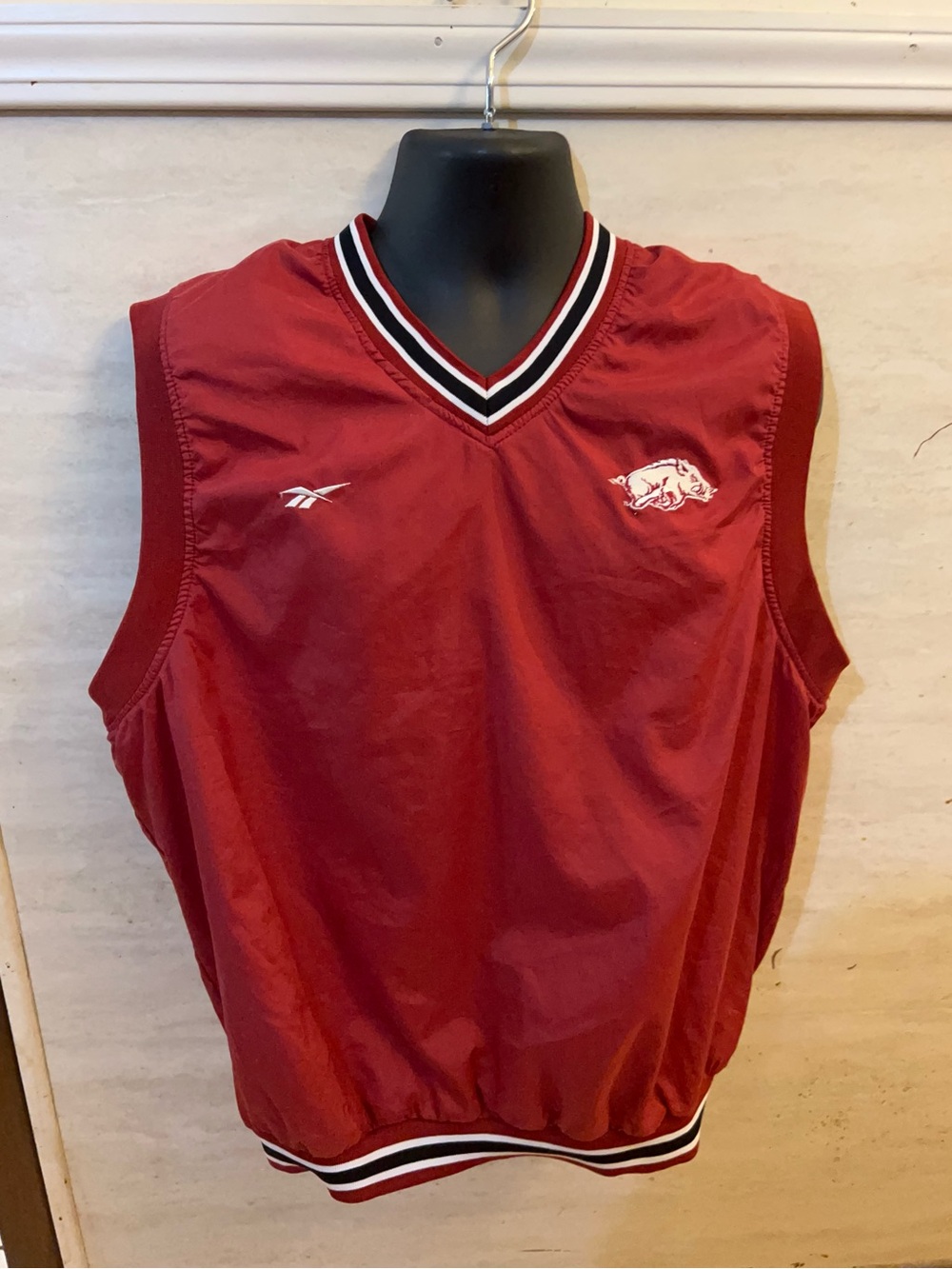 Vintage 1990s Reebok Arkansas
Razorbacks V-neck windbreaker vest.
